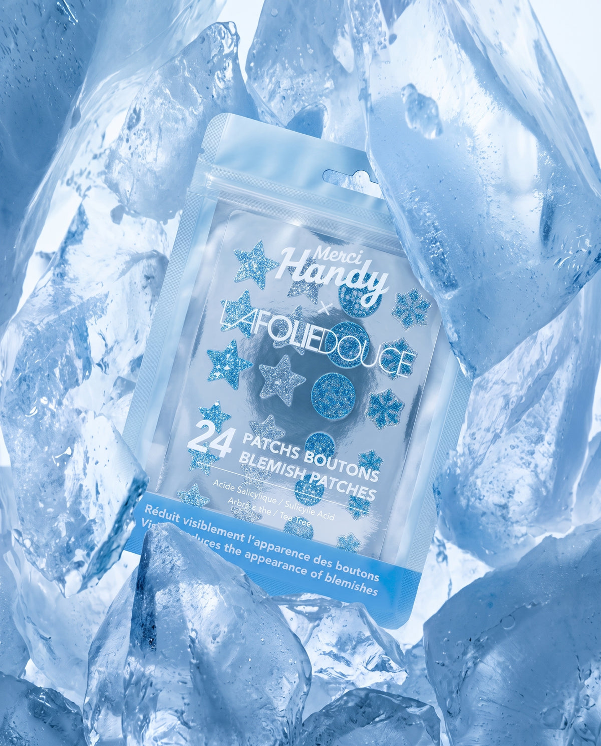 24 Patchs Boutons x La Folie Douce™ Merci Handy – boîte de 24 patchs posée dans la glace