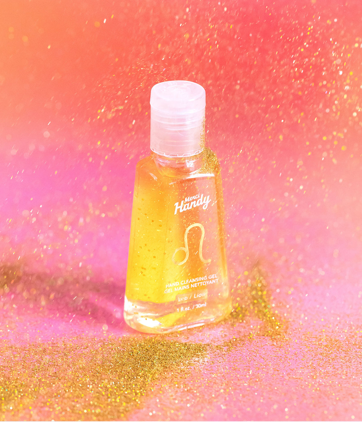 Gel Mains Nettoyant Lion Merci Handy – flacon sur fond doré pailleté
